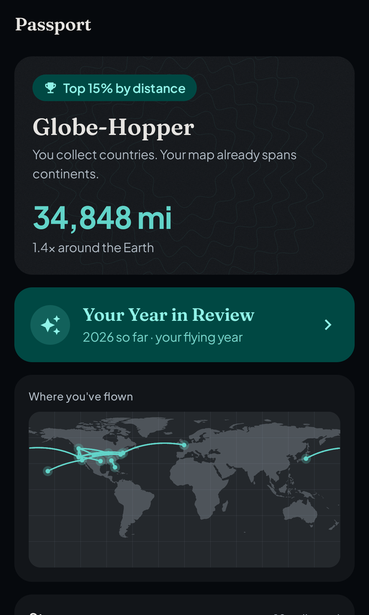 FlightDex Passport screen with lifetime travel stats and a world map of flown routes
